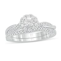 1/2 CT. T.w. Diamond Frame Twist Shank Bridal Set in 10K White Gold