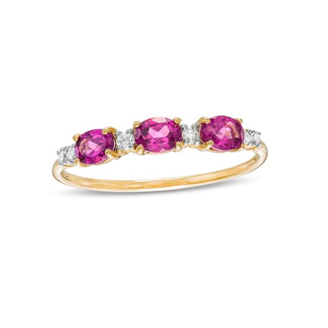 Sideways Oval Rhodolite Garnet and 1/15 CT. T.w. Diamond Three Stone Ring in 10K Gold