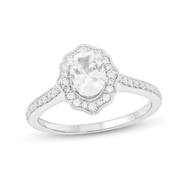 3/4 CT. T.w. Oval Diamond Flower Frame Vintage-Style Engagement Ring in 14K White Gold (I/I2)