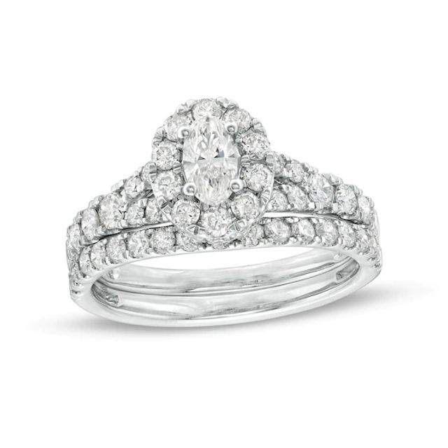 1-1/2 CT. T.w. Oval Diamond Frame Split Shank Bridal Set in 10K White Gold