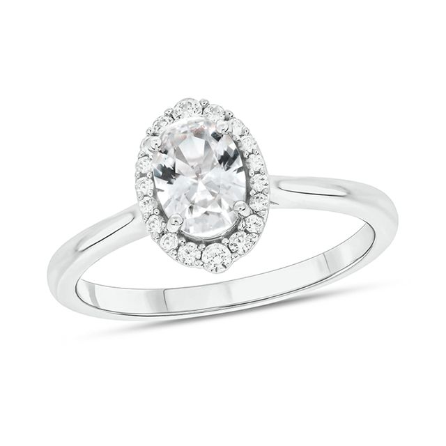 Oval White Lab-Created Sapphire and 1/6 CT. T.w. Diamond Frame Engagement Ring in 10K White Gold