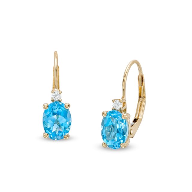 Oval Swiss Blue Topaz and 1/20 CT. T.w. Diamond Drop Earrings in 10K Gold