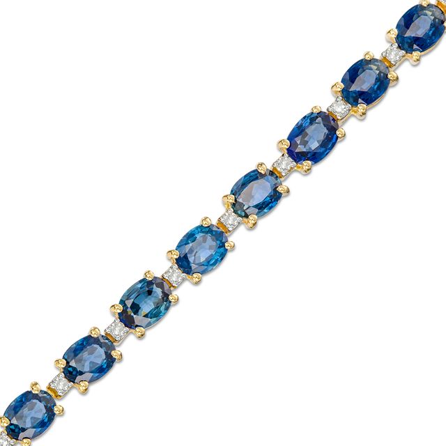 Oval Blue Sapphire and 1/6 CT. T.w. Diamond Alternating Line Bracelet in 10K Gold