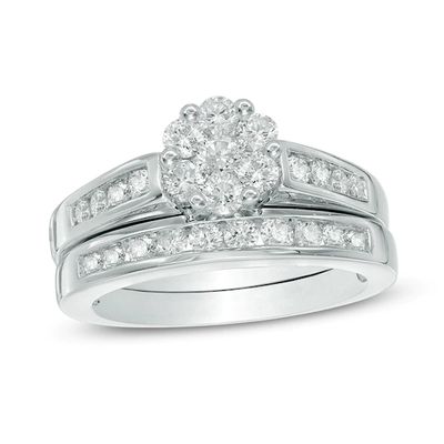Previously Owned - 1 CT. T.w. Multi-Diamond Flower Bridal Set in 10K White Gold