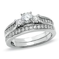 Previously Owned - 3/4 CT. T.w. Diamond Three Stone Bridal Set in 14K White Gold