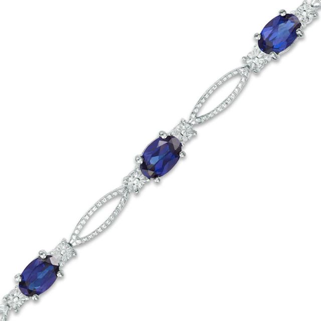 Previously Owned - Oval Lab-Created Blue Sapphire and Diamond Accent Bracelet in Sterling Silver - 7.25"