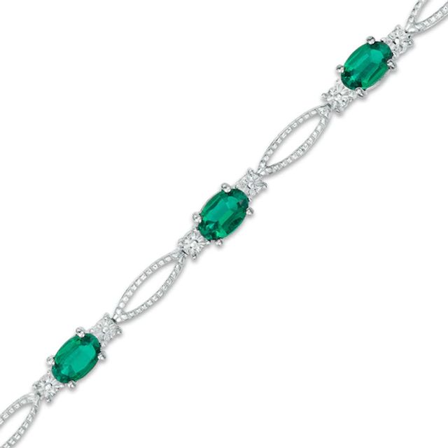 Previously Owned - Oval Lab-Created Emerald and Diamond Accent Bracelet in Sterling Silver - 7.25"