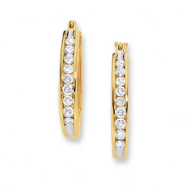 Previously Owned - 1/4 CT. T.w. Channel-Set Diamond Oval Hoop Earrings in 14K Gold