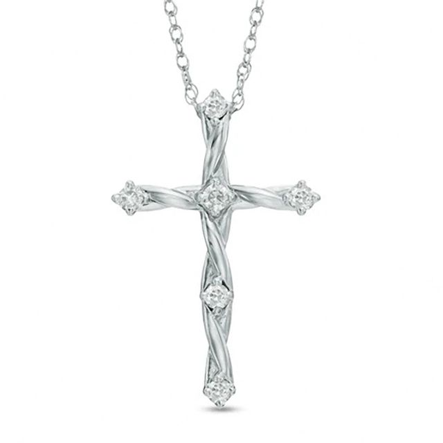 Previously Owned - 1/8 CT. T.w. Diamond Twisting Cross Pendant in 10K White Gold