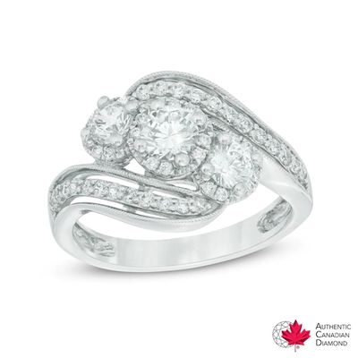 Previously Owned - 1 CT. T.w. Diamond Three Stone Slant Engagement Ring in 14K White Gold (I/I2)