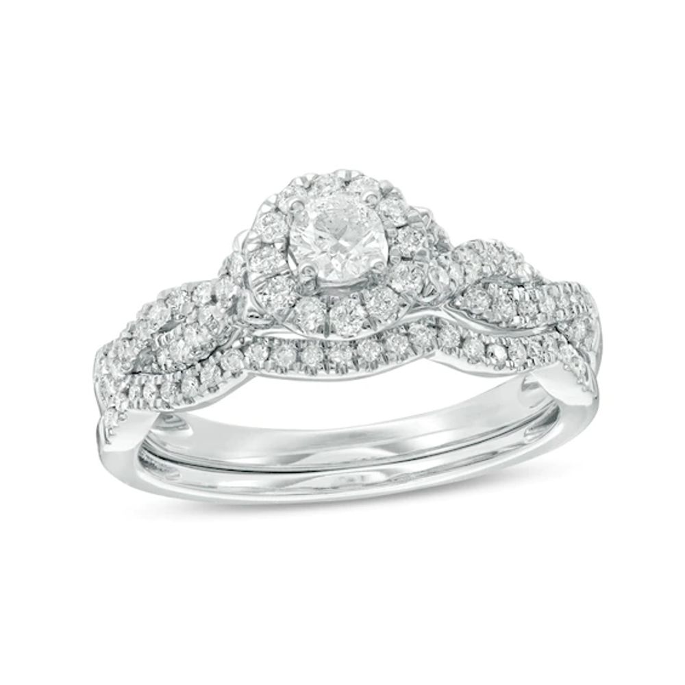 Previously Owned - 1/2 CT. T.w. Diamond Frame Twist Bridal Set in 10K White Gold
