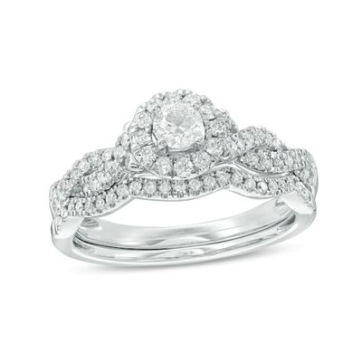 Previously Owned - 1/2 CT. T.w. Diamond Frame Twist Bridal Set in 10K White Gold
