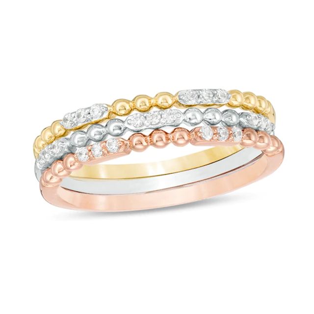 Previously Owned - 1/6 CT. T.w. Diamond and Beaded Three Piece Stackable Band Set in 10K Tri-Tone Gold