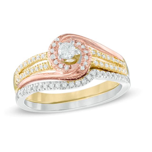 Previously Owned - 1/3 CT. T.w. Diamond Swirl Bridal Set in 10K Tri-Tone Gold