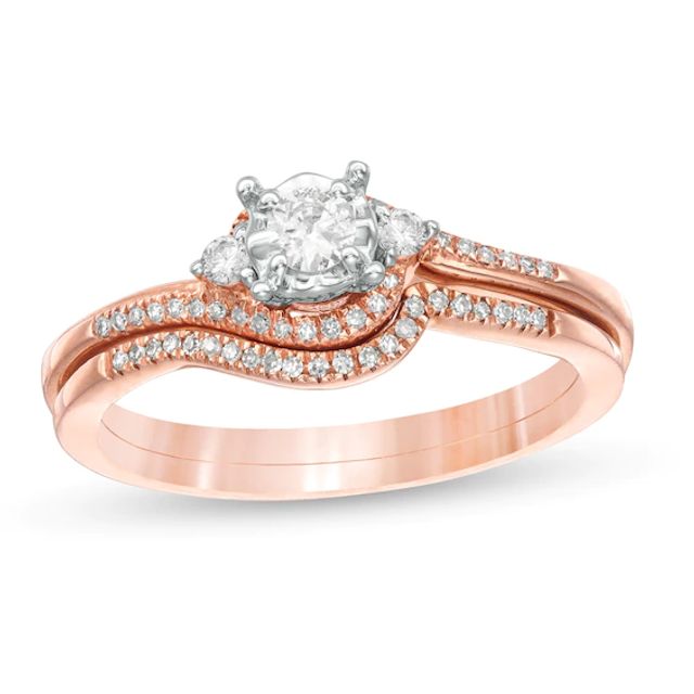 Previously Owned 1/4 CT. T.w. Diamond Bypass Three Stone Soldered Bridal Set in 10K Rose Gold