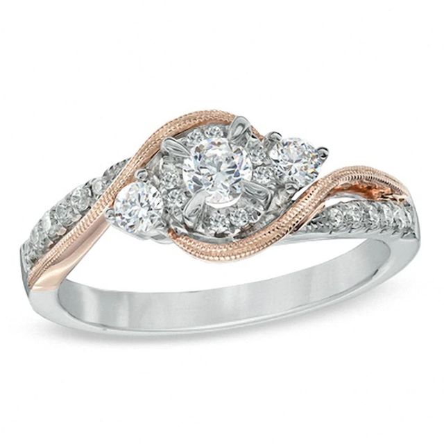 Previously Owned - 1/2 CT. T.w. Diamond Three Stone Swirl Engagement Ring in 10K Two-Tone Gold