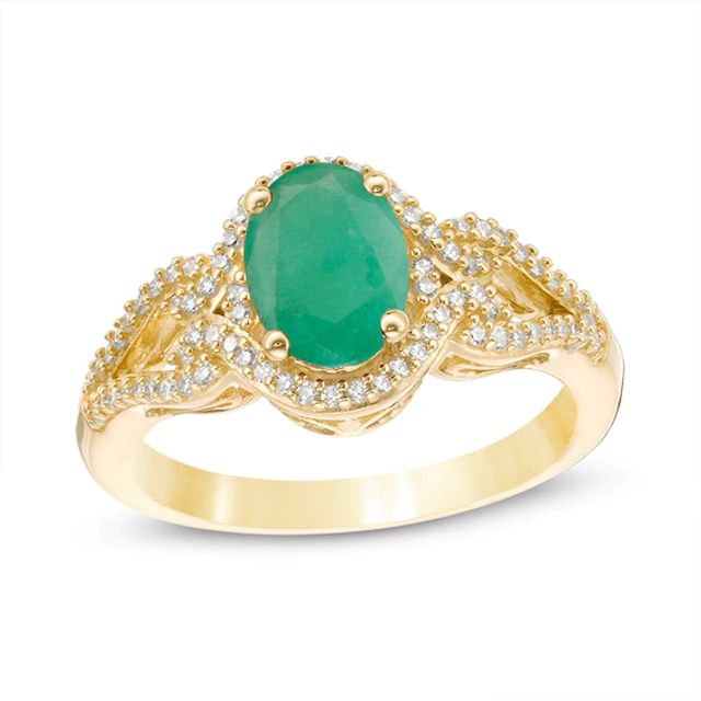 Previously Owned - Oval Emerald and 1/5 CT. T.w. Diamond Frame Scrolling Split Shank Ring in 10K Gold