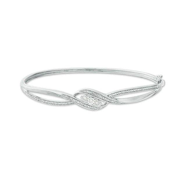 Previously Owned - 1/5 CT. T.w. Diamond Three Stone Bypass Ribbon Bangle in Sterling Silver