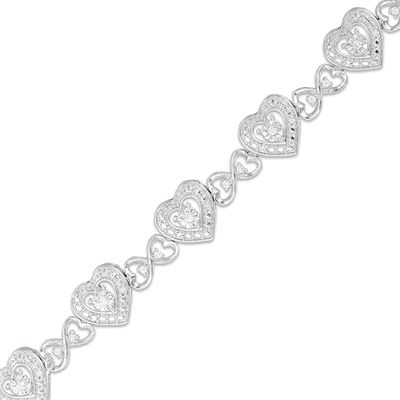 Previously Owned - 1/4 CT. T.w. Diamond Hearts Line Bracelet in Sterling Silver