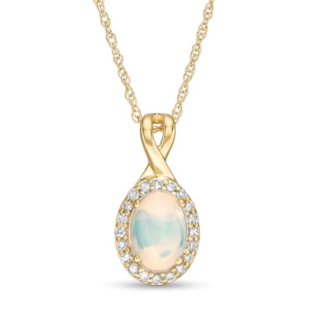 Previously Owned - Oval Opal and 1/15 CT. T.w. Diamond Frame Pendant in 10K Gold