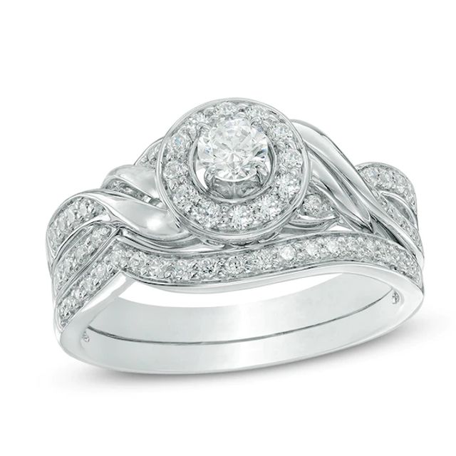Previously Owned - 5/8 CT. T.w. Diamond Frame Twist Bridal Set in 10K White Gold