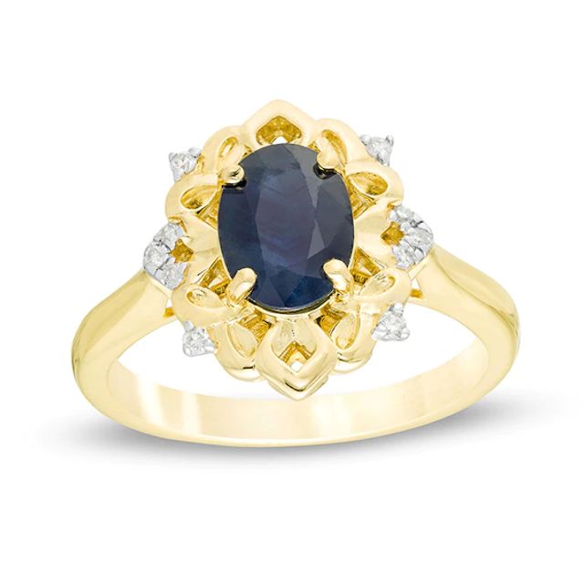 Previously Owned - Oval Blue Sapphire and 1/20 CT. T.w. Diamond Ornate Ring in 10K Gold
