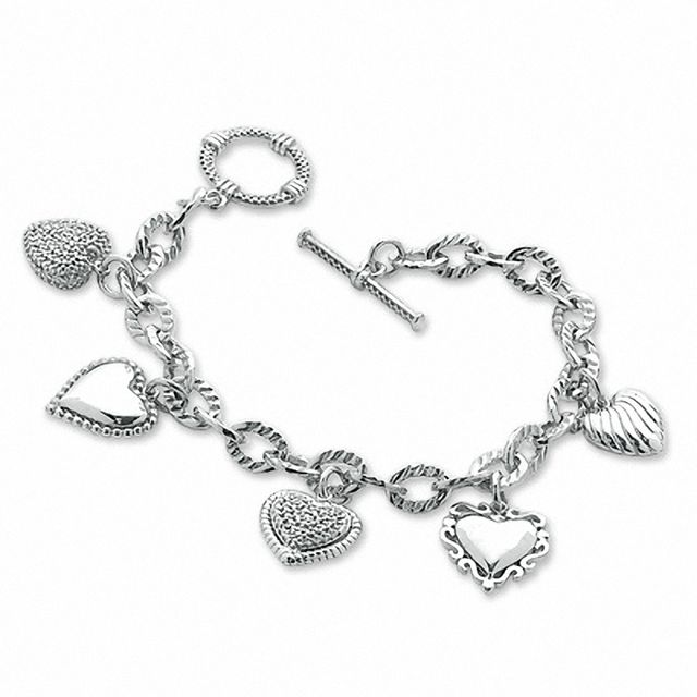 Previously Owned - 1/5 CT. T.w. Diamond Heart Assorted Charm Bracelet in Sterling Silver