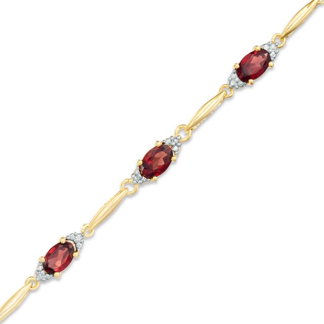 Previously Owned - Oval Garnet and Diamond Accent Bracelet in Sterling Silver and 10K Gold Plate - 7.25"