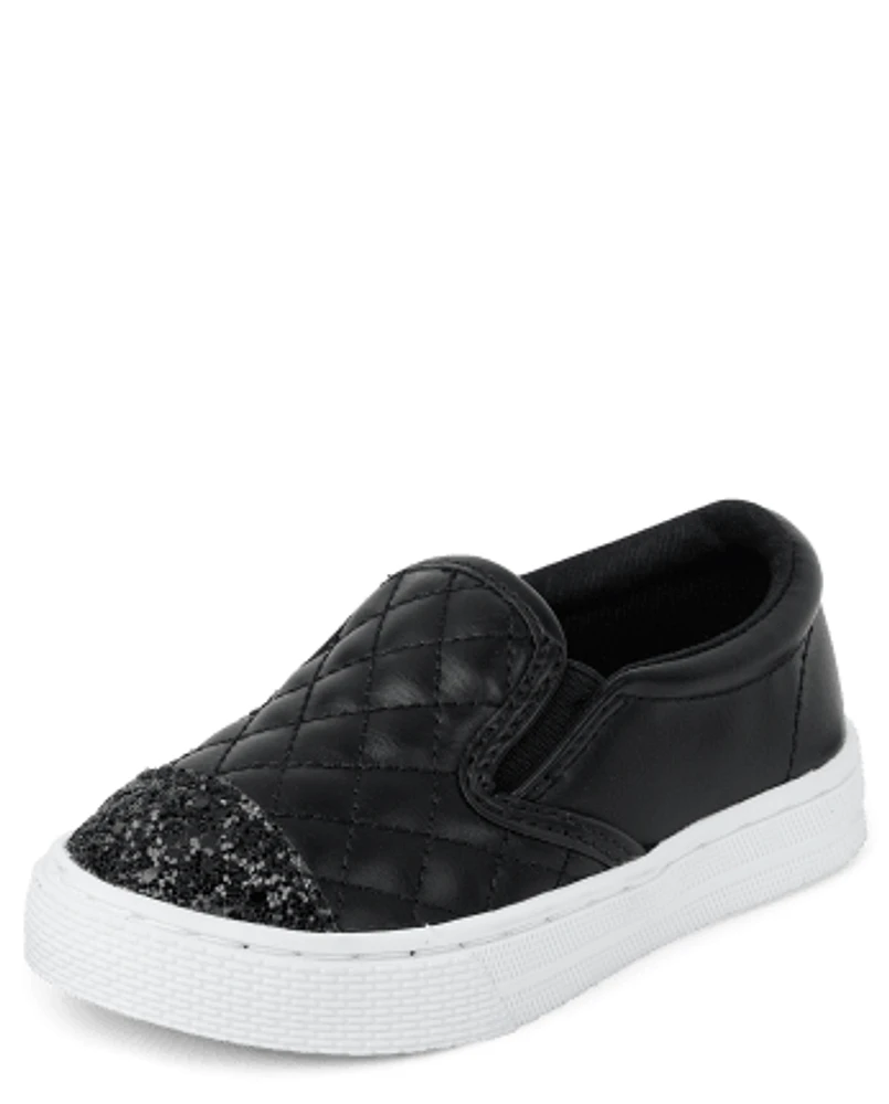 Black leather quilted slip on sneakers top