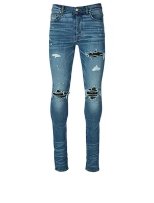 AMIRI Mx1 Cracked Paint Jeans With Leather Patches | Square One AMIRI Mx1 Cracked Paint Jeans With Leather Patches | Square One