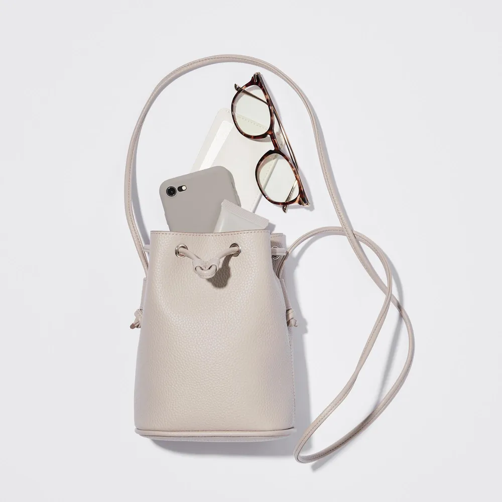 UNIQLO FAUX LEATHER DRAWSTRING MINI SHOULDER BAG | Yorkdale Mall