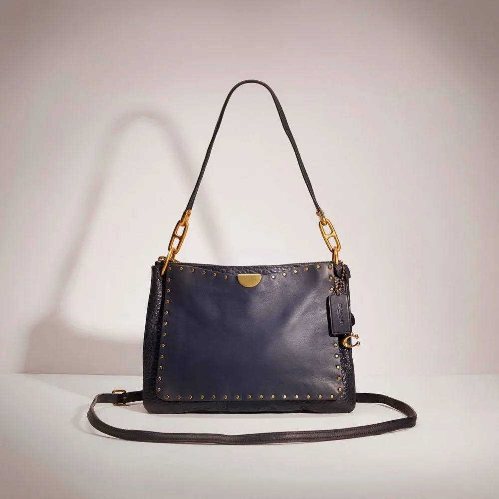 Dreamer shoulder bag online with rivets