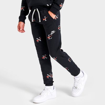 Nike sportswear all hot sale over print track pants