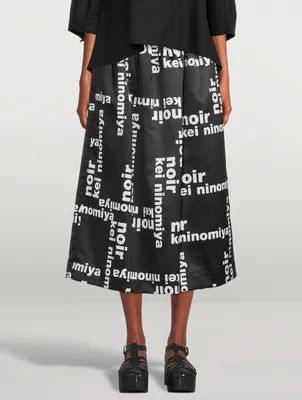 NOIR KEI NINOMIYA Satin Midi Skirt In Logo Print | Yorkdale Mall