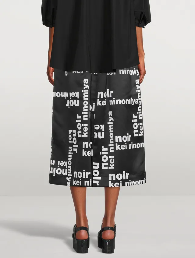 NOIR KEI NINOMIYA Satin Midi Skirt In Logo Print | Yorkdale Mall