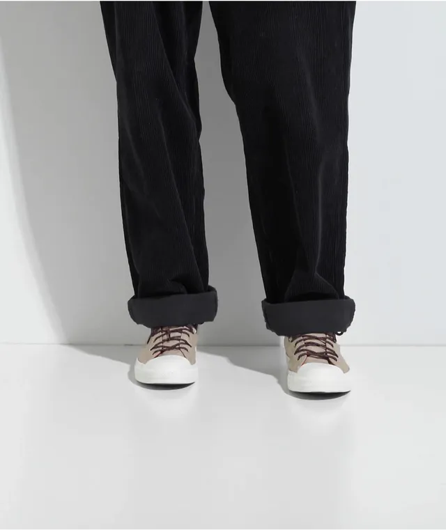 Black converse store with khakis