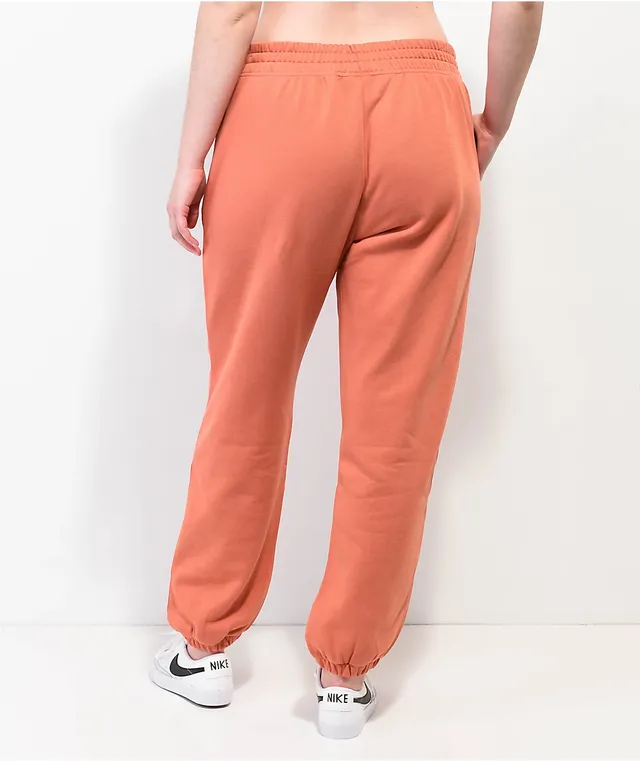 Orange nike joggers sales