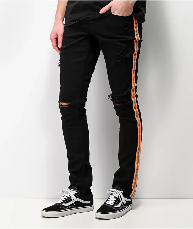 Black jeans orange stripe top